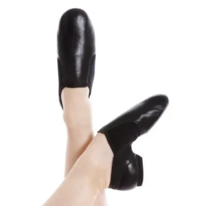 A person wearing black shoes and white socks.