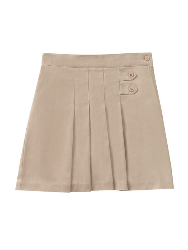 A tan skirt with an embroidered logo on the front.